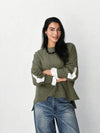 The statement Top in mint green