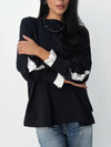 The statement Top in black