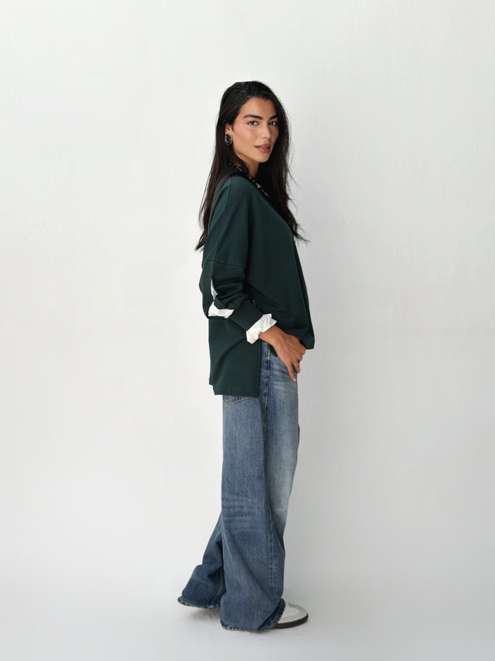 The statement Top in dark olive