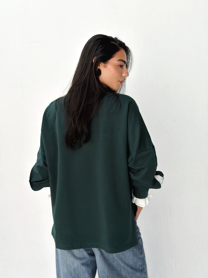 The statement Top in dark olive