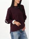 The statement Top in burgundy