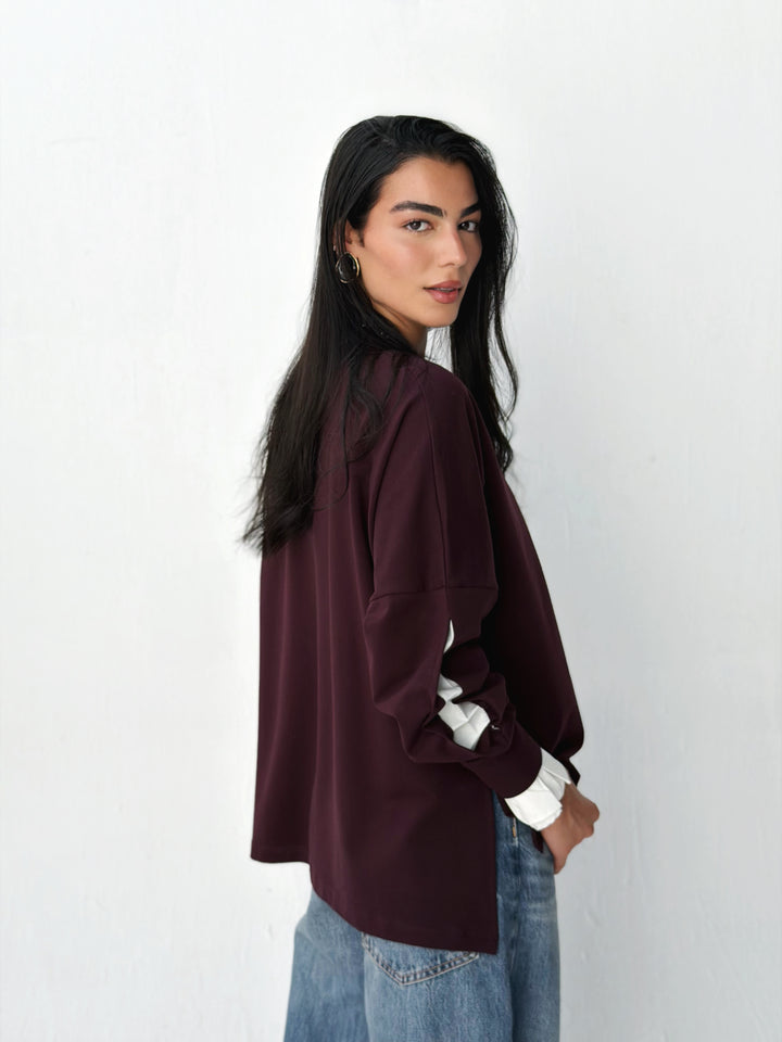 The statement Top in burgundy