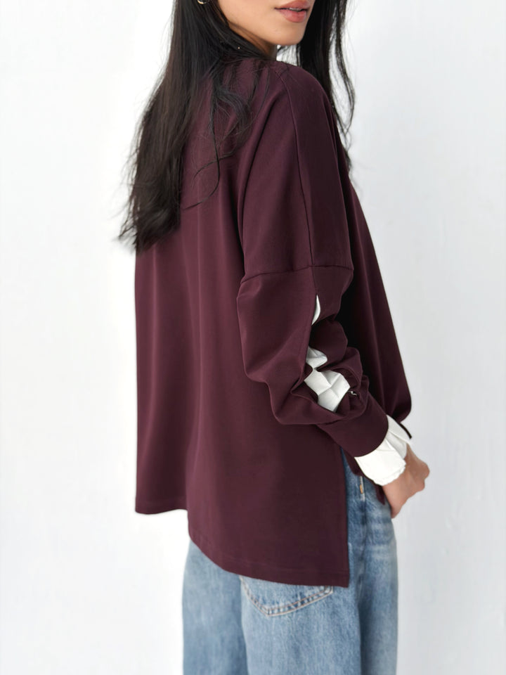 The statement Top in burgundy